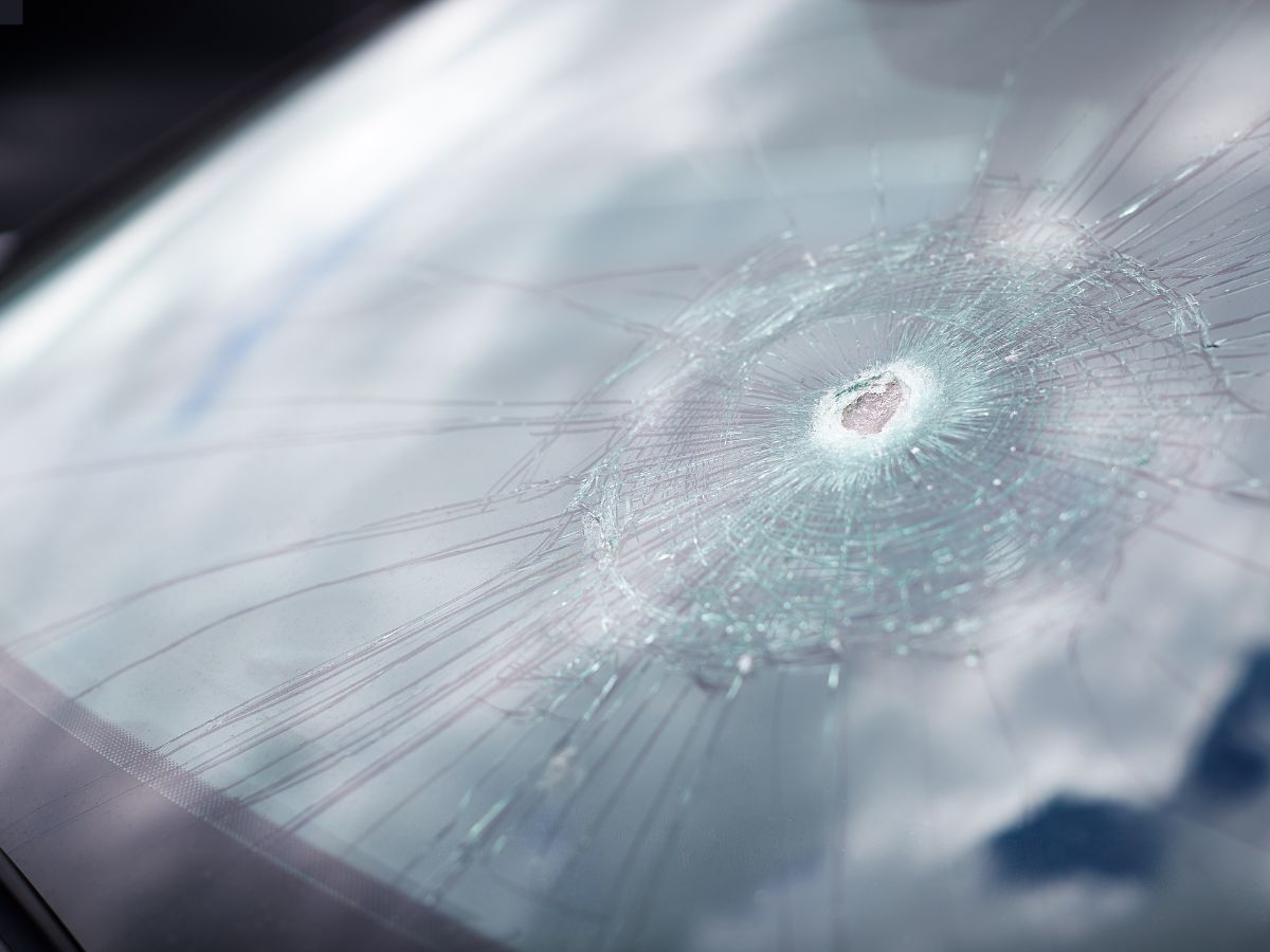 Windscreen with a crack spreading from an impact point